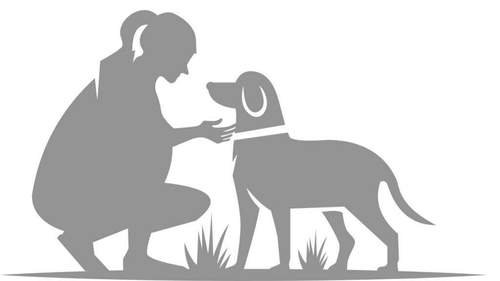 Das Bild zeigt eine stilisierte, graue Silhouette auf weißem Hintergrund. Eine weibliche Person mit zusammengebundenem Haar hockt auf dem Boden und streckt eine Hand freundlich einem Hund entgegen. Der Hund steht ruhig vor der Person, trägt ein Halsband und blickt sie direkt an. Zwischen ihnen wachsen einige Grashalme, die die Szene in eine natürliche Umgebung setzen.
Die Körperhaltung und Nähe der beiden Figuren vermitteln Vertrauen, Kommunikation und Zusammenarbeit.

